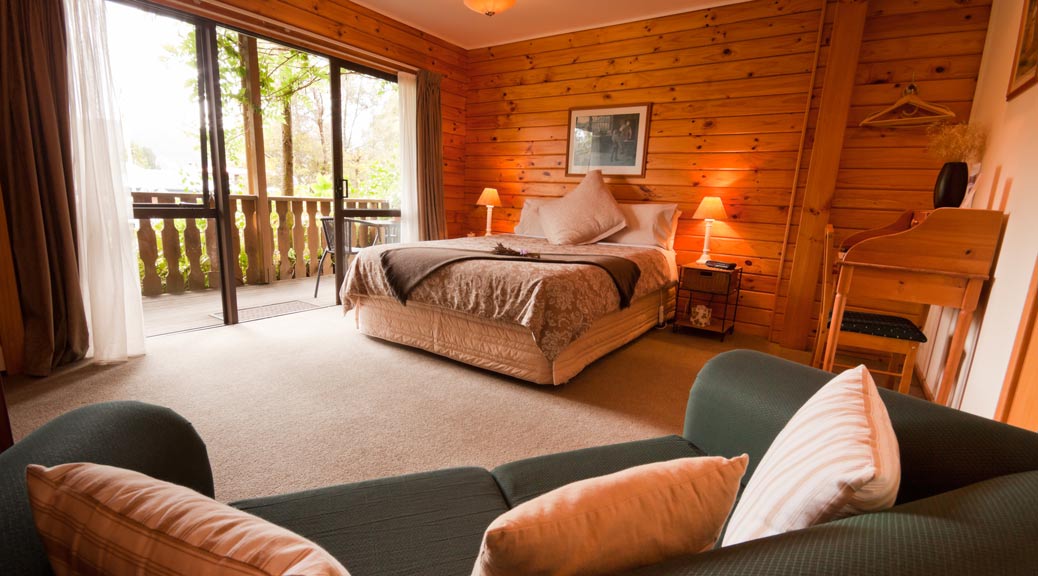 Interior of mountain wooden lodge bedroom