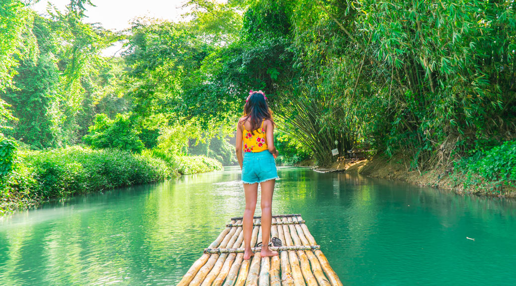 A Jamaican Tourist woman on Bamboo raft, Montego Bay