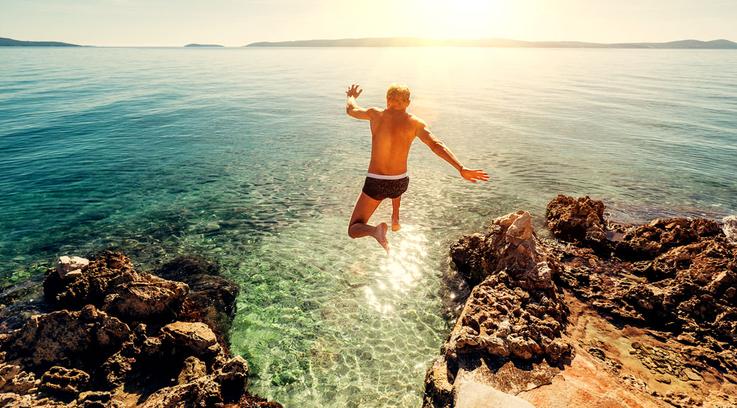 Man jumps in lagune water, Croatia