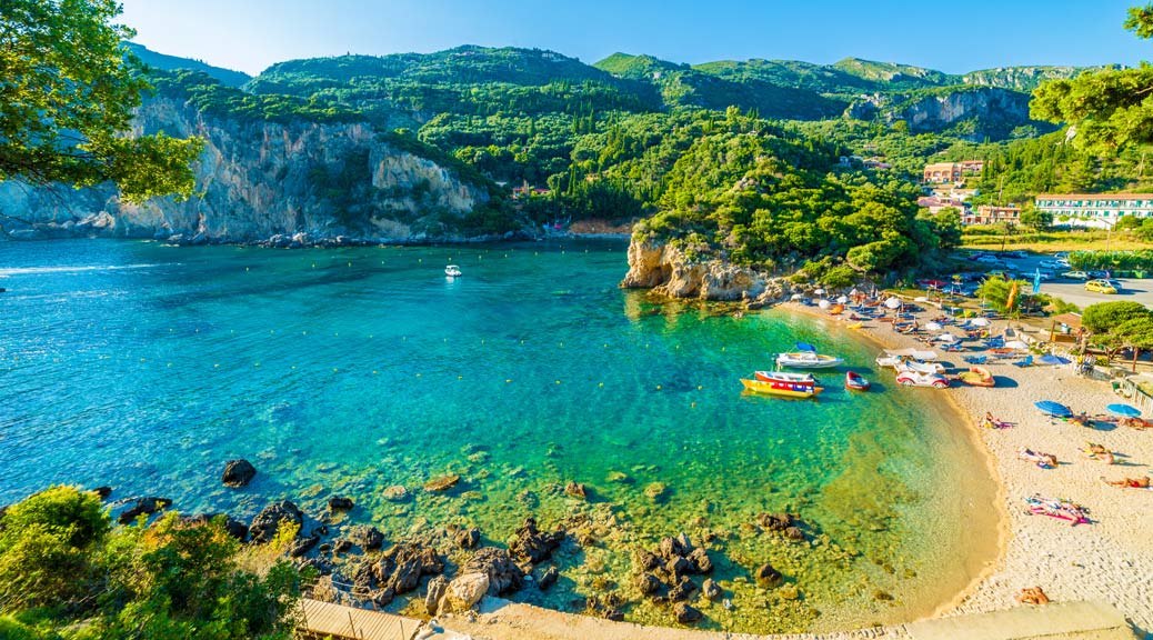 Beautiful beach and boat in Paleokastritsa, Corfu island, Greece