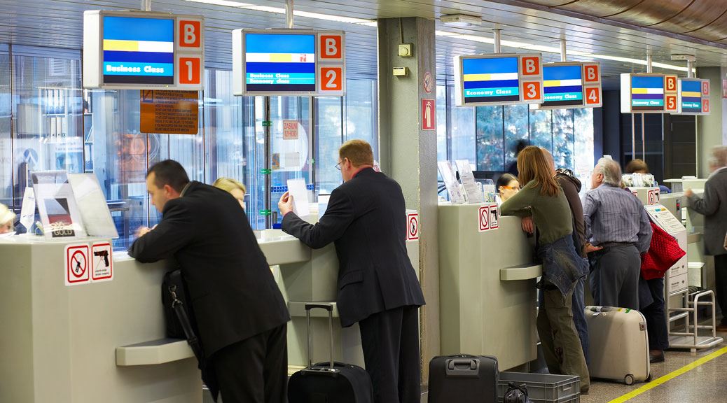people are standing in check in counter europe teletext