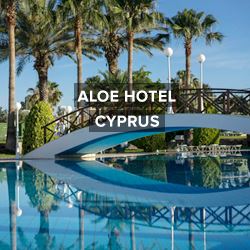 Palms along pool and bridge at Aloe Hotel Cyprus