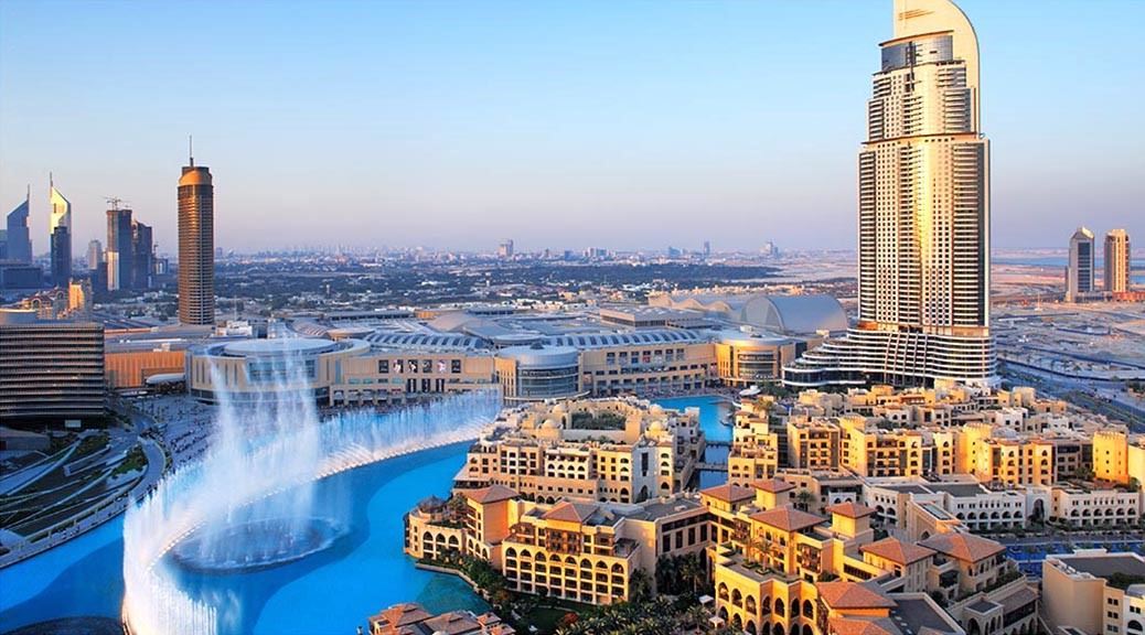 5 star hotels fountain and dubai city seen from above during sunset 