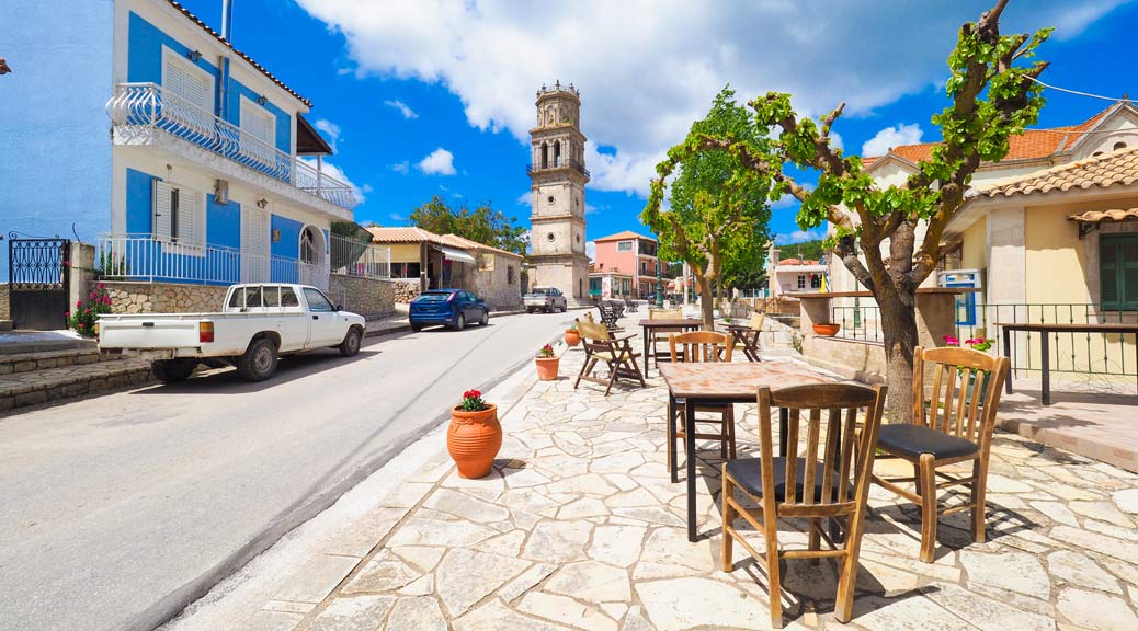 Traditional Greek Village on the island of Zakynthos with table and chairs in front of a taverna in western greece