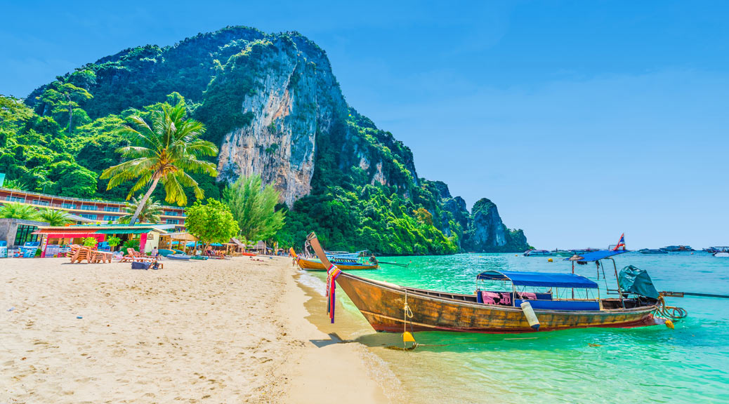 Tonsai Beach bay with traditional long tail boats parking in Phi Phi island, Krabi, Thailand