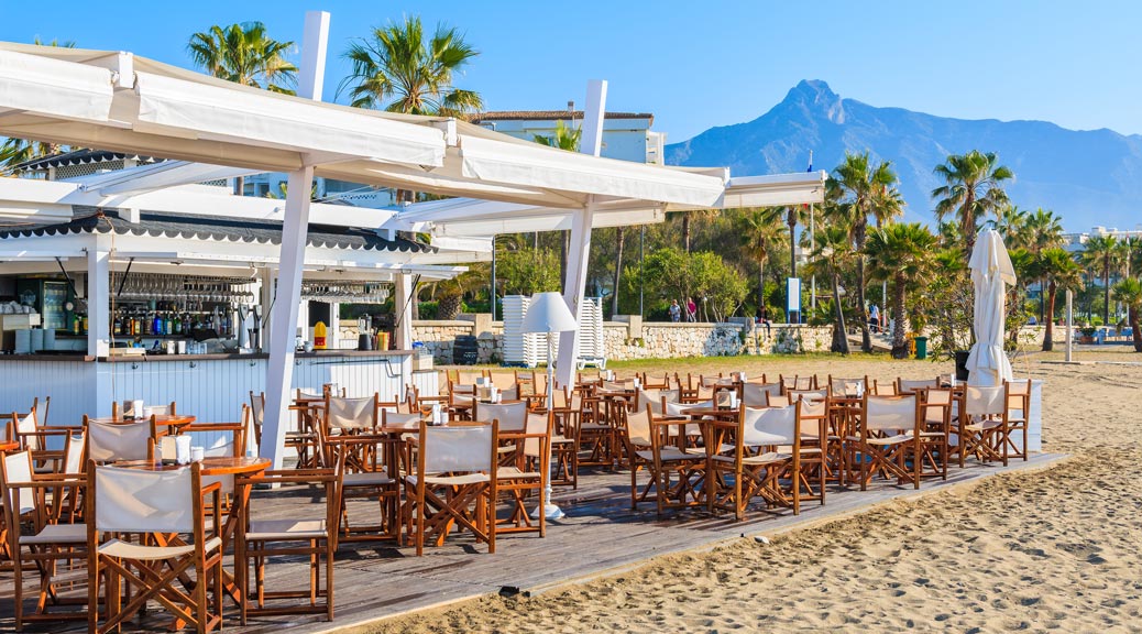 Bar on beautiful beach in Marbella town near Puerto Banus marina, Costa del Sol, Spain