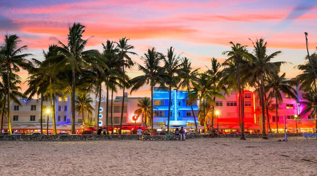 Clubs and bar lit up with colourful lighting at ocean drive in Miami florida
