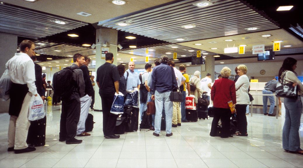 Passengers queue in immigration counter in europe airport