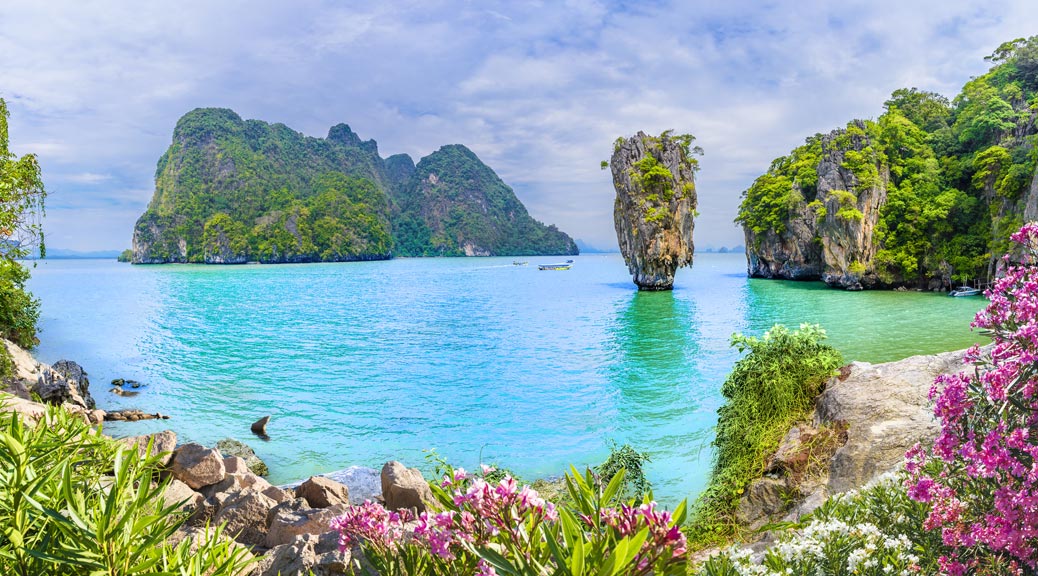 James Bond Island with colourful flowers Mountains and trees, Phang Nga bay, Thailand.
