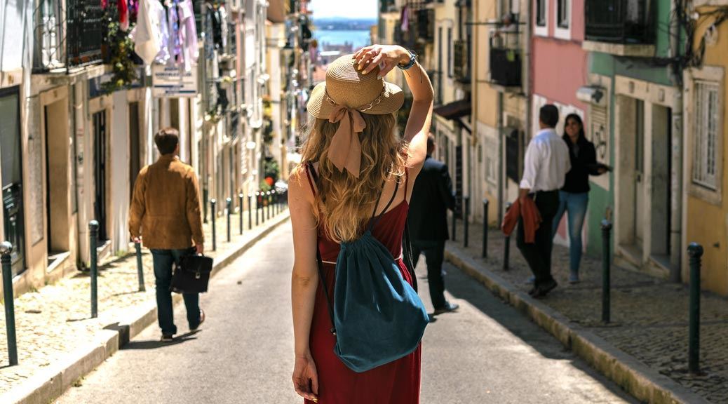 Woman-walking-in-a-street-in-Lisbon
