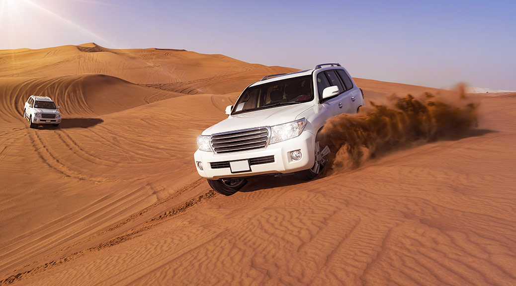 Desert Safari SUVs bashing through the arabian sand dunes