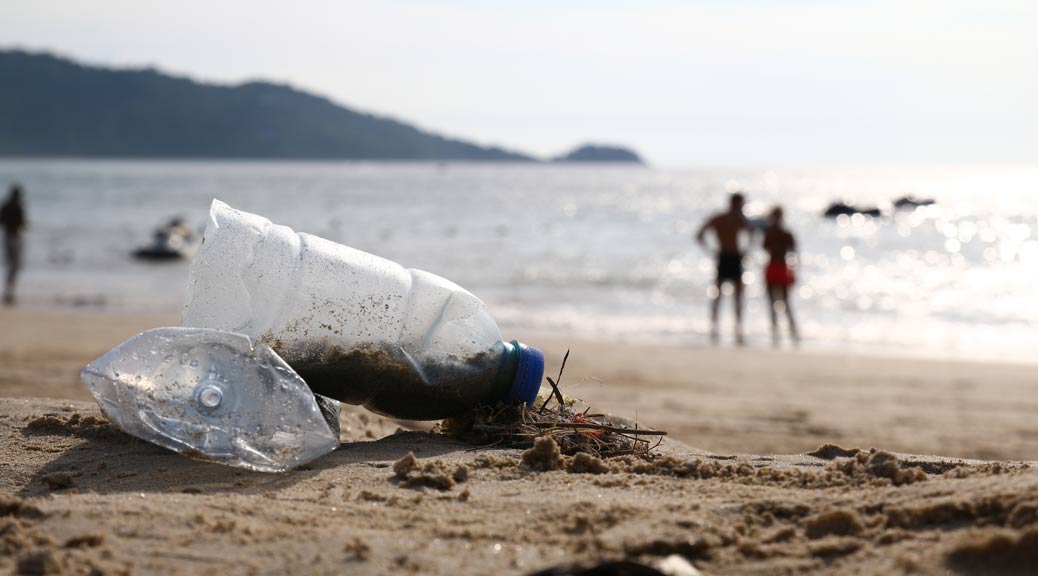 Plastic bottle litter on beach 