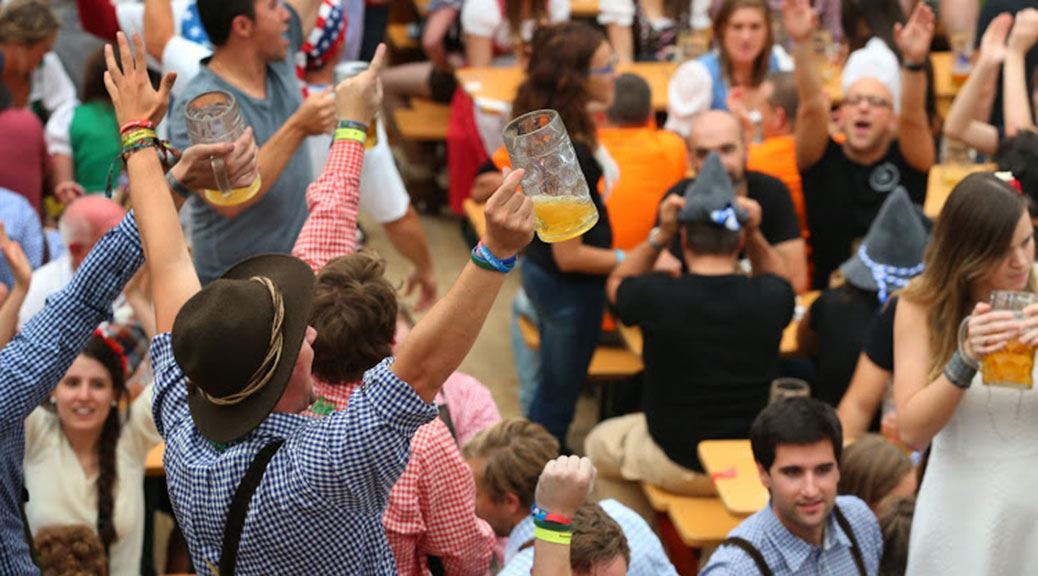 people enjoying with beer in oktoberfest germany