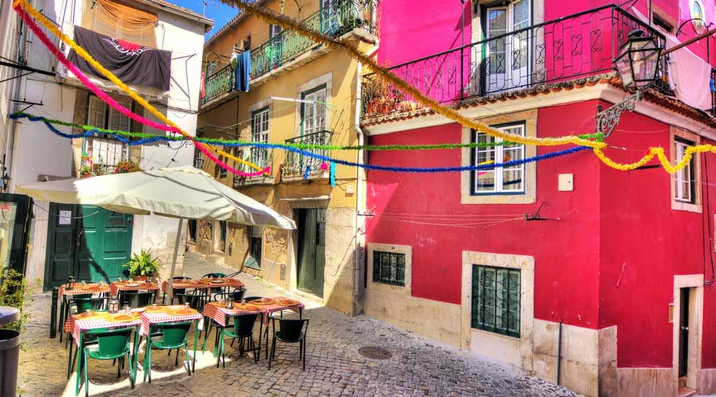 pink street with restaurants in lisbon portugal