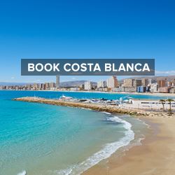 Beautiful white sandy beach backed by buildings in Costa Blanca, Spain