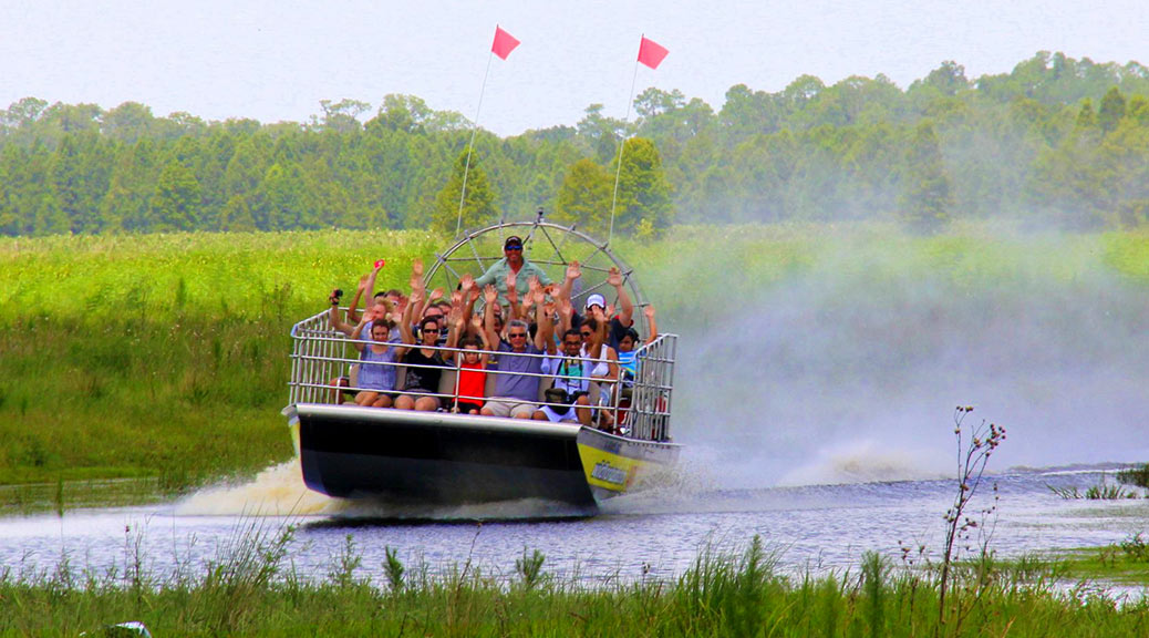 Visitors riding on an airboat in the everglades national park